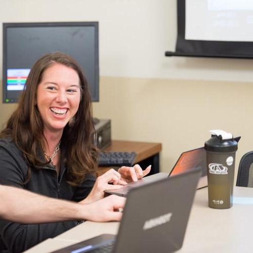 PE/HE Professor helping a student